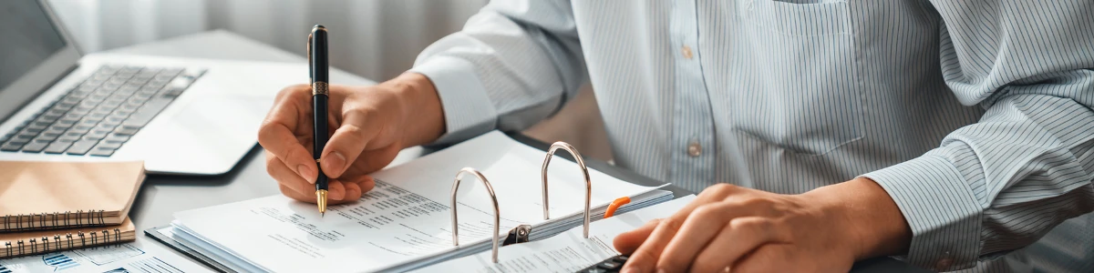 Accountant looking at numbers in a binder